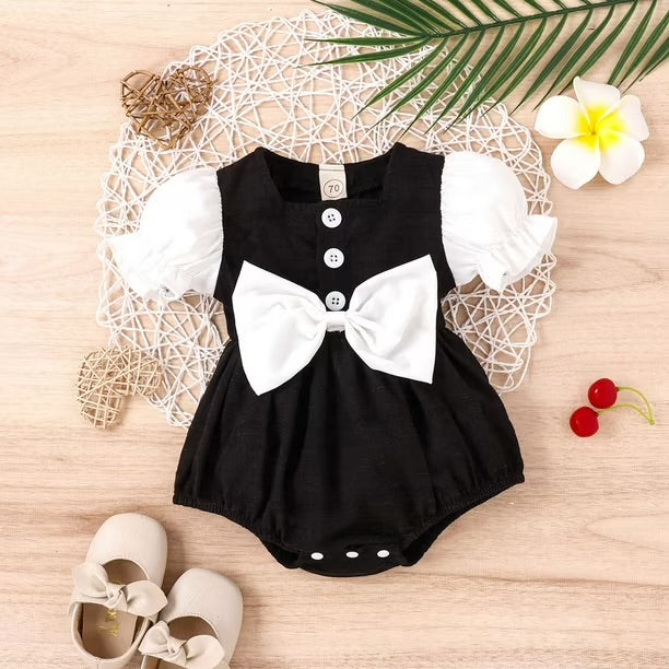 Elegant Black & White Baby Girl Romper with Large Bow Detail