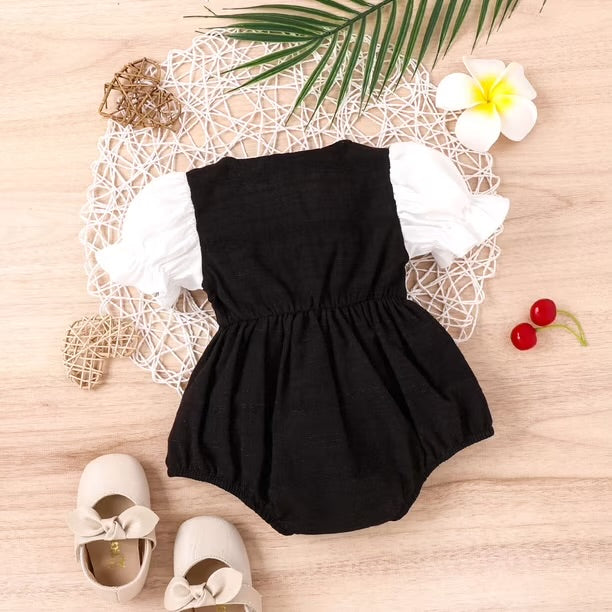 Elegant Black & White Baby Girl Romper with Large Bow Detail