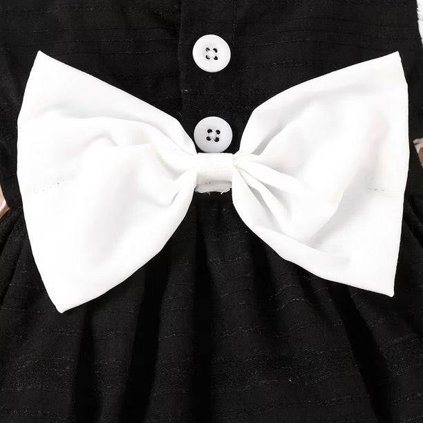 Elegant Black & White Baby Girl Romper with Large Bow Detail