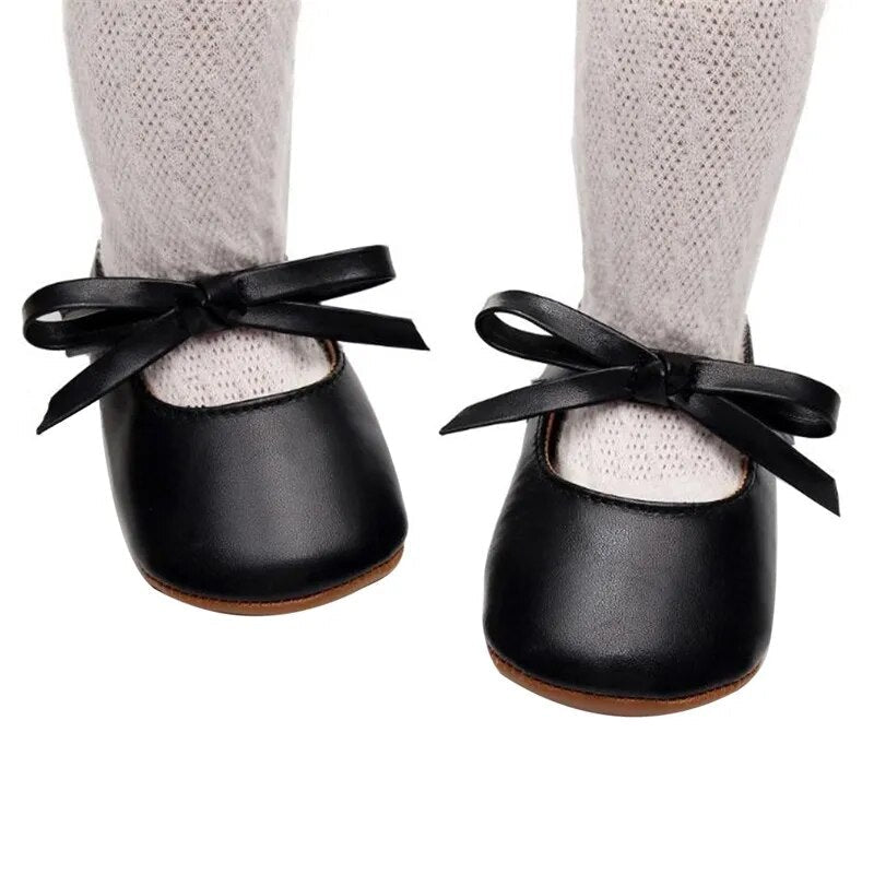 Cozy Black Baby Shoes with Tied Bow