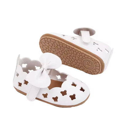 Elegant White Cut-Out Baby Shoes with Bow